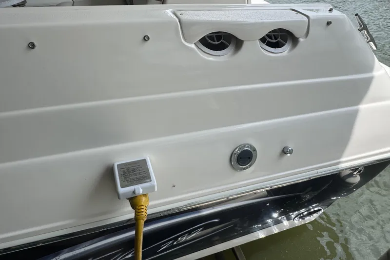 Slide: The Image of 2006 Rinker 282 Captiva Bowrider boat stern with power connection and water access. - 26
