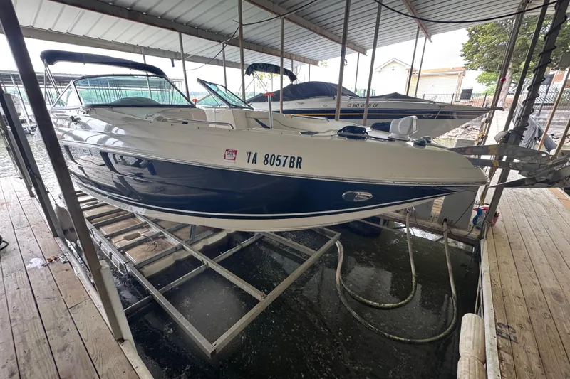 Slide: The Image of 2006 Rinker 282 Captiva Bowrider docked in covered marina slip. - 4