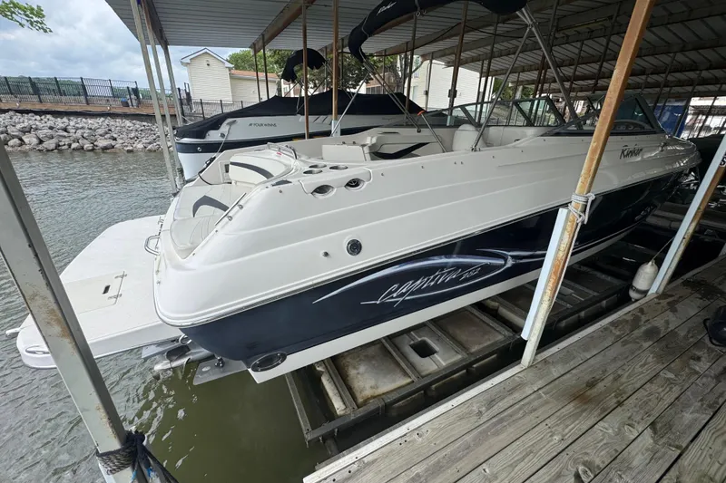 Slide: The Image of 2006 Rinker 282 Captiva Bowrider docked in a covered marina. - 5