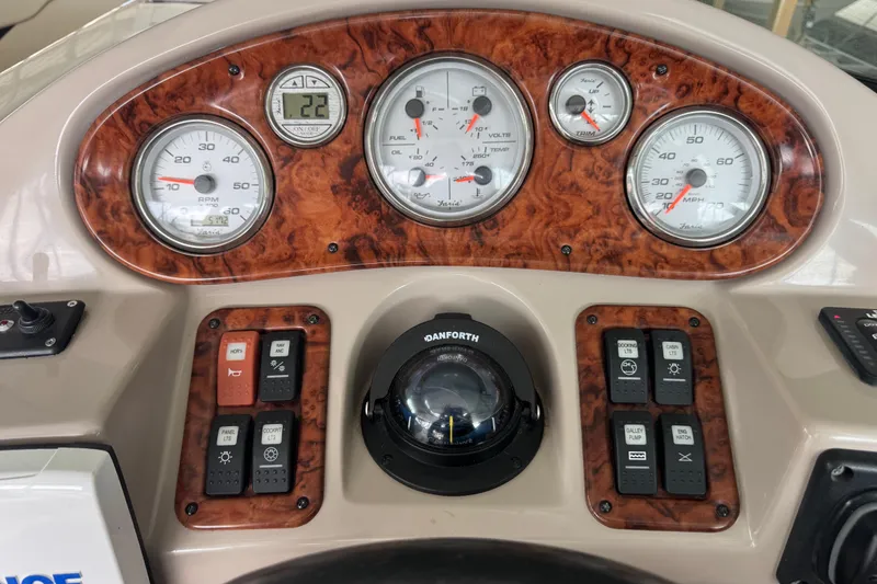 Slide: The Image of Dashboard of 2006 Rinker 282 Captiva Bowrider with gauges and controls. - 9
