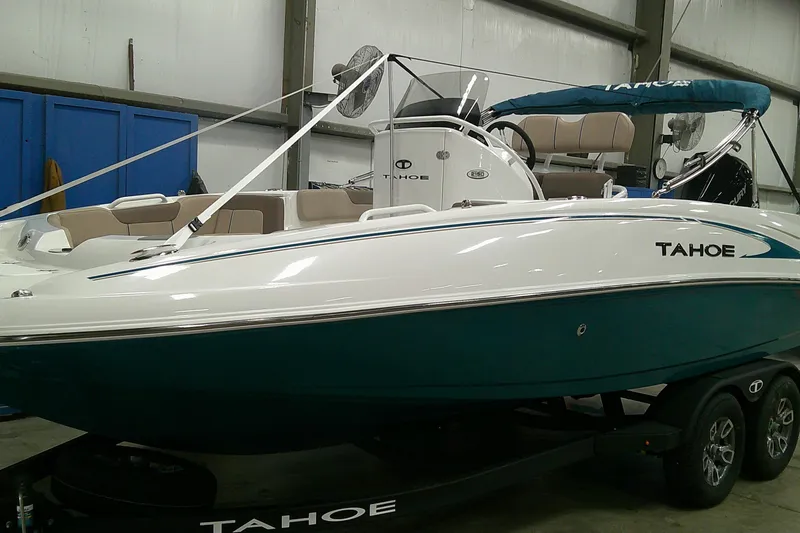 The Image of 2026 Tahoe 2150 CC boat in showroom, featuring sleek design and modern amenities. - 0