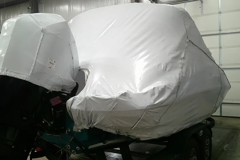 Slide: The Image of Covered 2026 Tahoe 2150 CC boat on trailer in storage facility. - 12