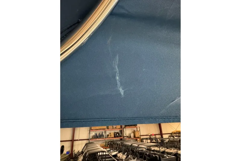 Slide: The Image of Blue fabric with a scratch, inside a warehouse, Tahoe 2150 CC, 2026 model. - 3