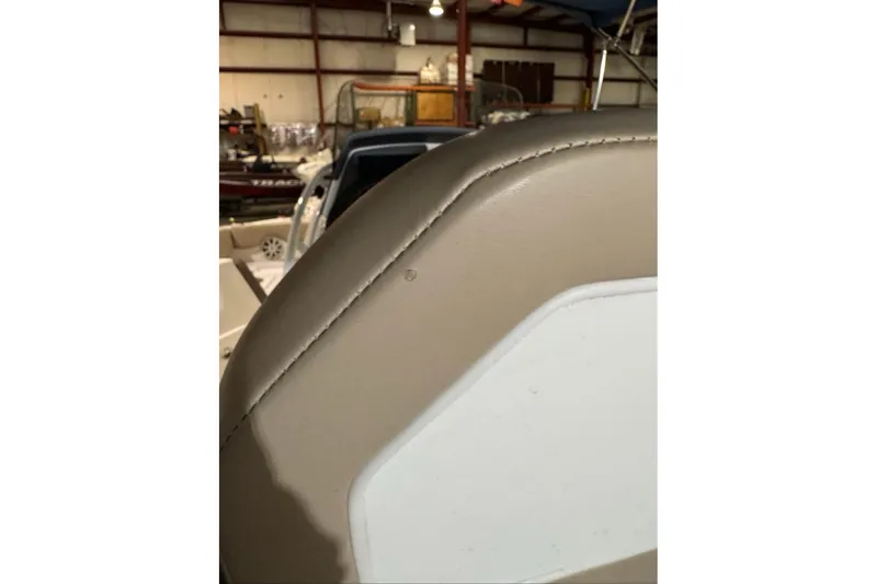 Slide: The Image of Close-up of 2026 Tahoe 2150 CC boat seat in a warehouse setting. - 4