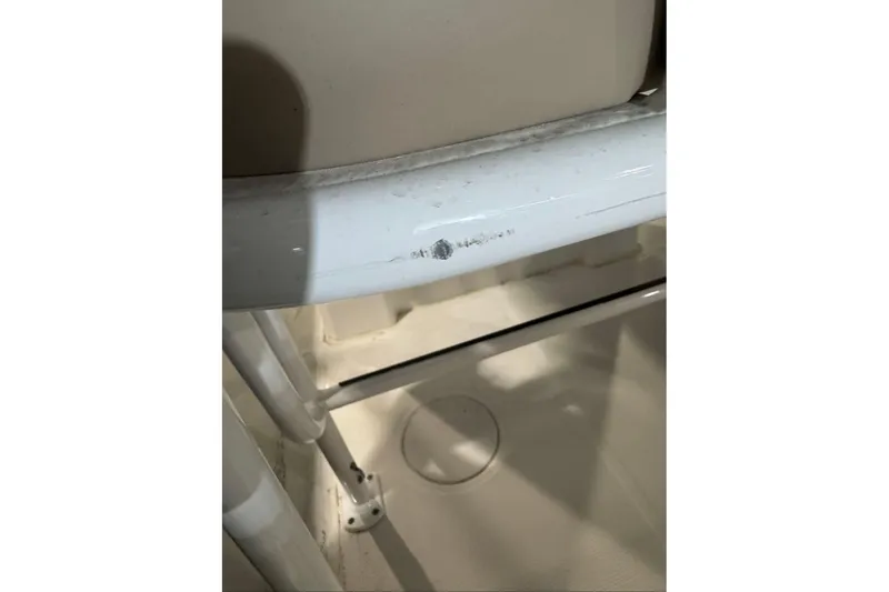 Slide: The Image of Close-up of a 2026 Tahoe 2150 CC boat interior, showing white metal framework. - 6