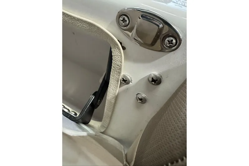 Slide: The Image of Close-up of 2026 Tahoe 2150 CC boat hardware and screws detail. - 7