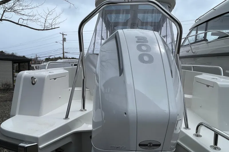 Slide: The Image of 2023 Nimbus Tender 8 boat with powerful 300 horsepower engine, docked outdoors. - 10