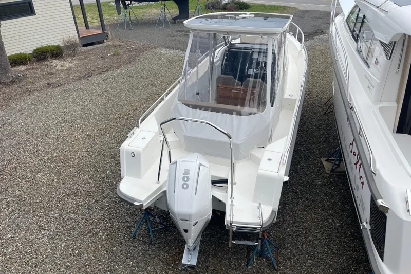 Slide: The Image of 2023 Nimbus Tender 8 boat with Mercury 300 outboard engine on gravel. - 15