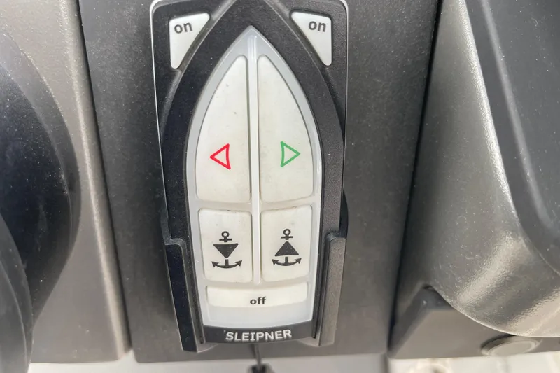 Slide: The Image of Control panel of 2023 Nimbus Tender 8 boat with directional and anchor buttons. - 23