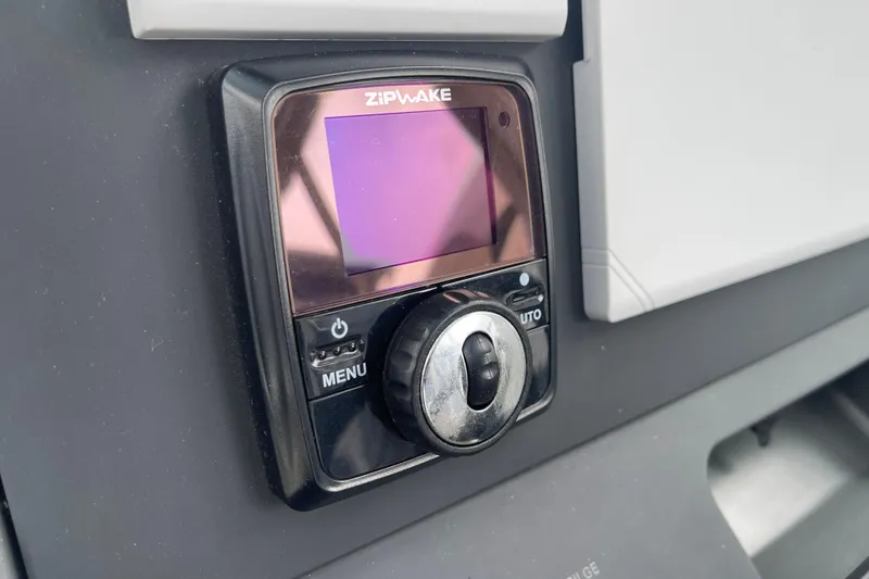 Slide: The Image of Zipwake control panel on 2023 Nimbus Tender 8 boat dashboard. - 25