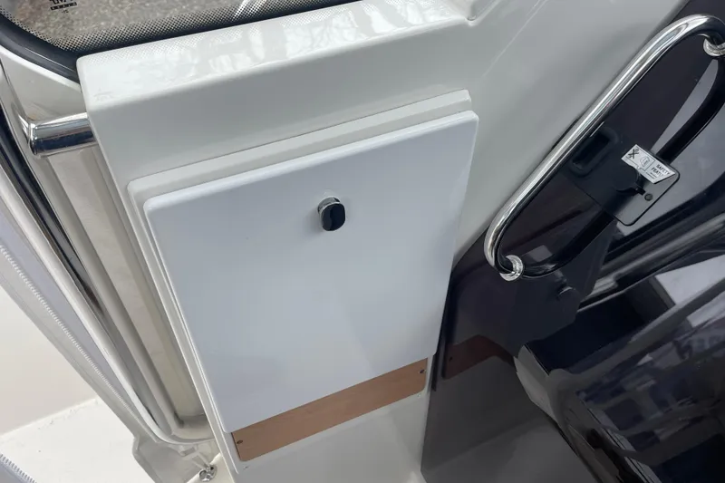 Slide: The Image of 2023 Nimbus Tender 8 interior detail with sleek white panel and chrome handle. - 26