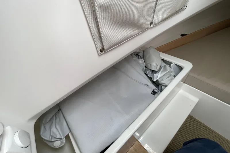 Slide: The Image of Storage compartment in 2023 Nimbus Tender 8 boat interior. - 30