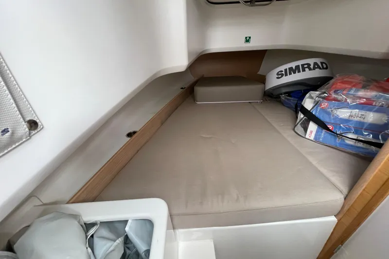 Slide: The Image of Interior cabin of 2023 Nimbus Tender 8 boat with storage and equipment. - 31