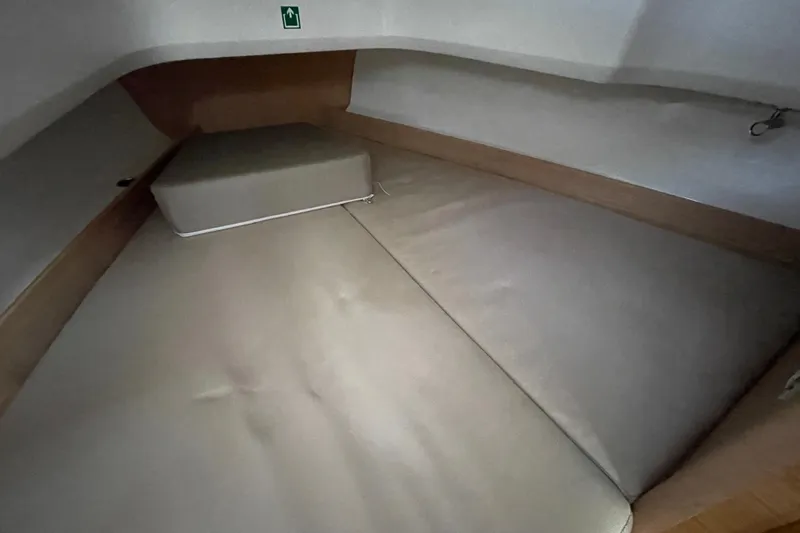 Slide: The Image of Interior cabin of 2023 Nimbus Tender 8 boat with cushioned seating. - 33