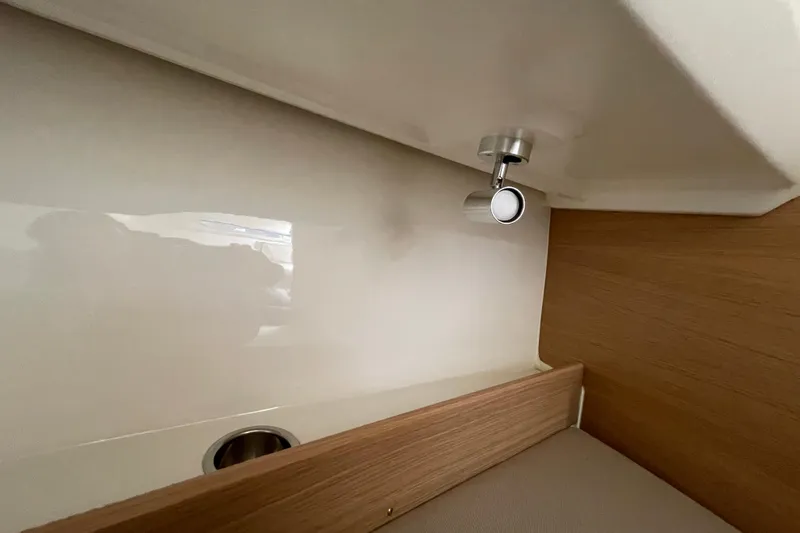 Slide: The Image of Interior detail of 2023 Nimbus Tender 8, featuring sleek wood and metal finishes. - 36
