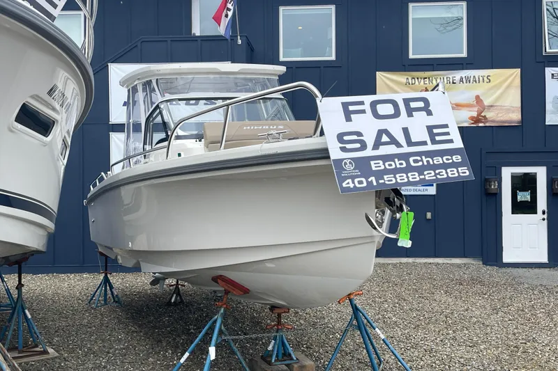 Slide: The Image of 2023 Nimbus Tender 8 boat for sale, displayed outdoors with contact information. - 4