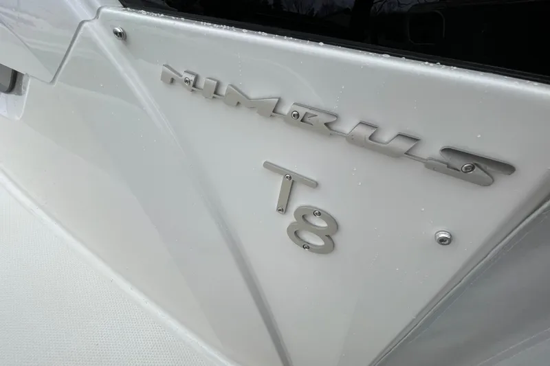 Slide: The Image of 2023 Nimbus Tender 8 boat logo on sleek white surface. - 42