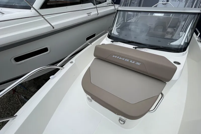 Slide: The Image of 2023 Nimbus Tender 8 boat with cushioned seating and sleek design. - 44