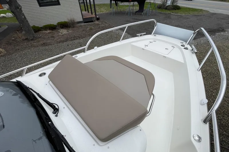 Slide: The Image of 2023 Nimbus Tender 8 boat with cushioned seating and sleek design. - 45