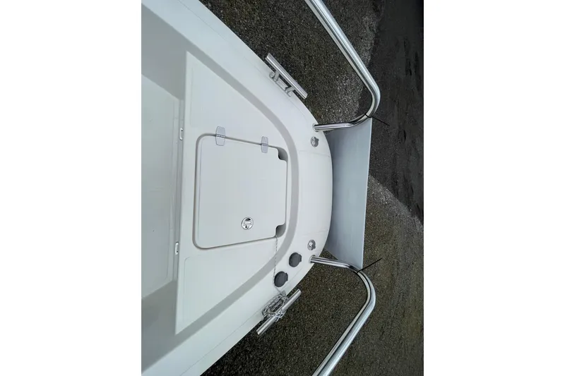 Slide: The Image of 2023 Nimbus Tender 8 boat deck with stainless steel railings and storage compartment. - 46