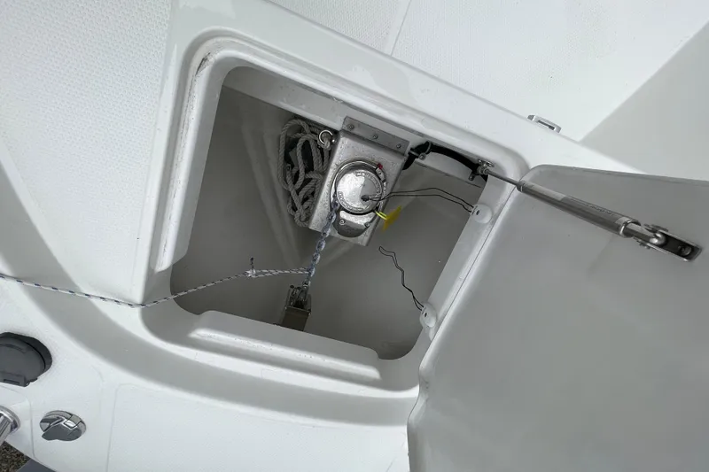 Slide: The Image of Anchor compartment of 2023 Nimbus Tender 8 boat with chain and winch. - 47