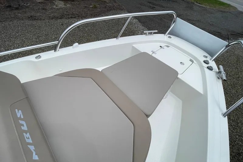 Slide: The Image of 2023 Nimbus Tender 8 boat with beige upholstery and stainless steel railing. - 48