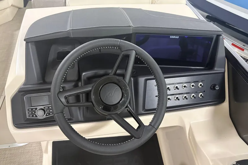 Slide: The Image of Steering wheel and dashboard of 2026 Alera M25Q boat with control panel and display. - 10