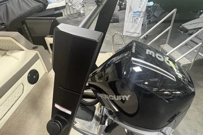 Slide: The Image of Alera M25Q 2026 boat with Mercury engine, displayed indoors. - 16