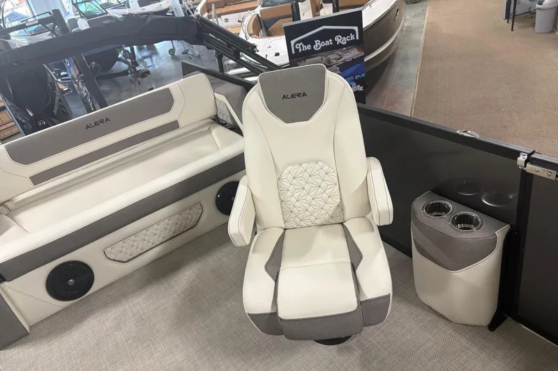 Slide: The Image of Luxury seating in a 2026 Alera M25Q boat, featuring elegant design and cup holders. - 7