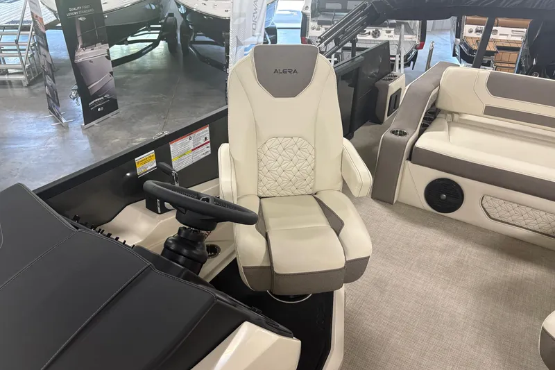 Slide: The Image of Captain's chair in a 2026 Alera M25Q boat, featuring luxurious seating and modern design. - 8