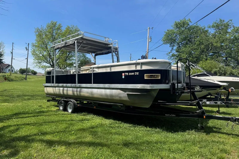 The Image of 2008 Voyager Pontoons 25 Extreme Cruise Express on trailer in grassy area. - 0
