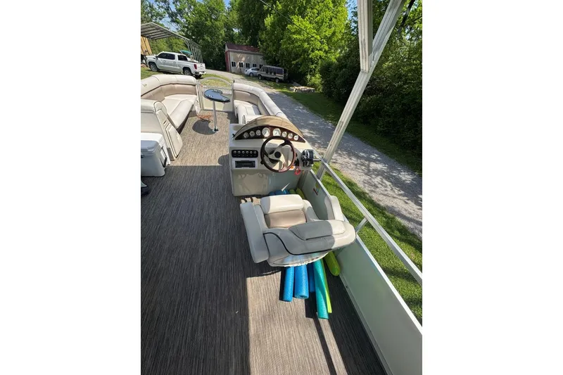 Slide: The Image of 2008 Voyager Pontoons 25 Extreme Cruise Express interior with helm and seating area. - 12