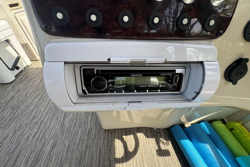 Slide: The Image of Kenwood stereo system on 2008 Voyager Pontoons 25 Extreme Cruise Express boat dashboard. - 13