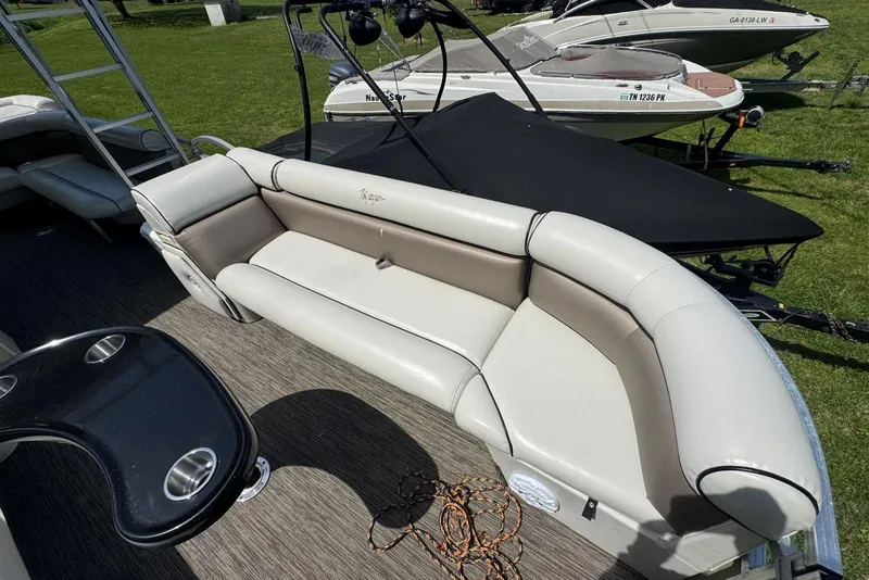 Slide: The Image of 2008 Voyager Pontoons 25 Extreme Cruise Express with plush seating and sleek design. - 8