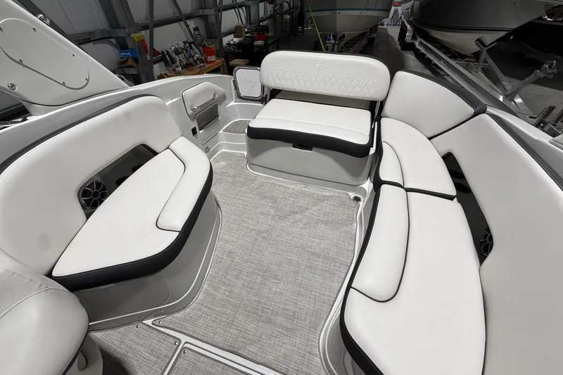 Slide: The Image of 2023 Crownline 280 SS boat interior with white seating and modern design. - 10