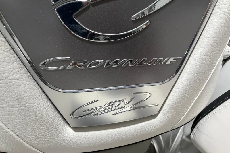 Slide: The Image of 2023 Crownline 280 SS Gen 2 logo on white leather interior. - 19