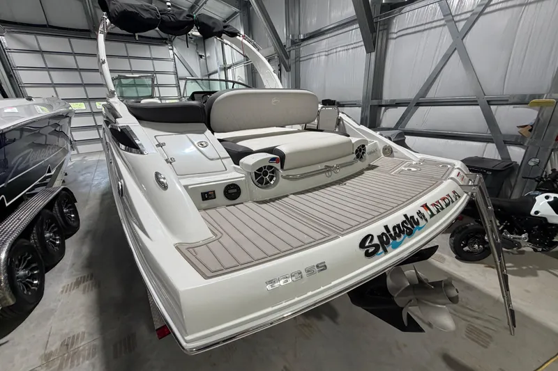 Slide: The Image of 2023 Crownline 280 SS boat in a garage, showcasing sleek design and modern features. - 22