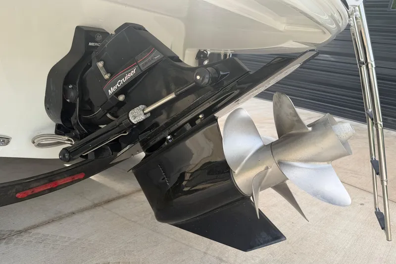 Slide: The Image of 2023 Crownline 280 SS boat with MerCruiser Bravo Three outdrive and stainless steel propeller. - 27