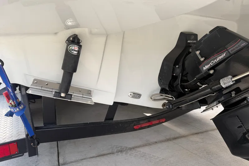 Slide: The Image of 2023 Crownline 280 SS boat with MerCruiser engine and Lenco trim tab on trailer. - 28