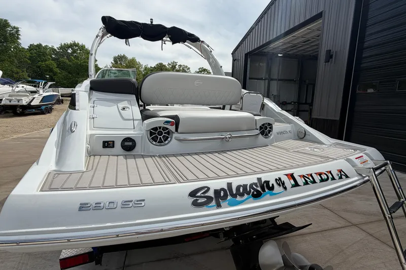Slide: The Image of 2023 Crownline 280 SS boat with "Splash of India" text on the stern. - 3