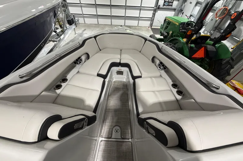 Slide: The Image of 2023 Crownline 280 SS boat interior with luxurious white seating and cup holders. - 4