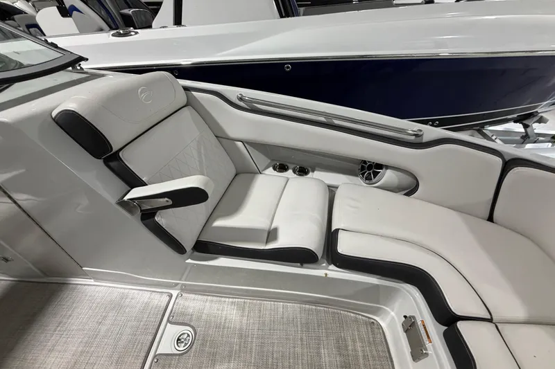 Slide: The Image of 2023 Crownline 280 SS boat interior with luxurious white seating and modern design. - 6