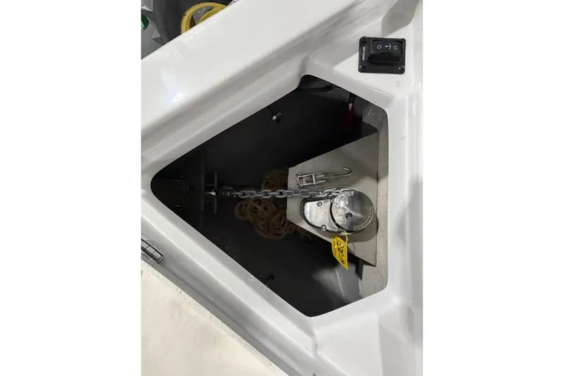 Slide: The Image of Anchor compartment of 2023 Crownline 280 SS boat with chain and rope. - 7
