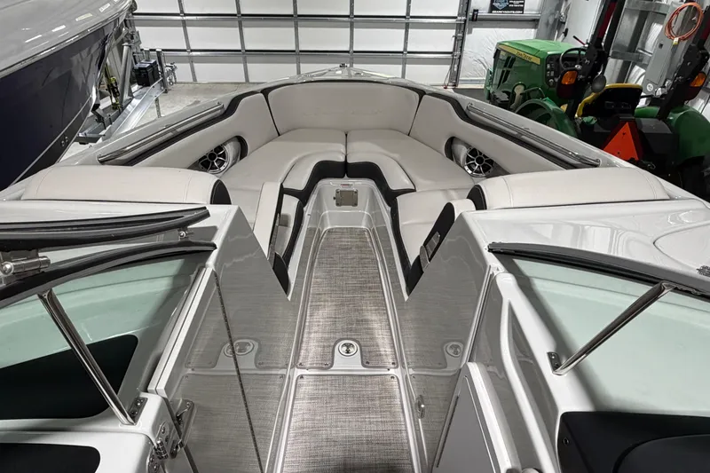 Slide: The Image of 2023 Crownline 280 SS boat interior with plush seating and modern design. - 8