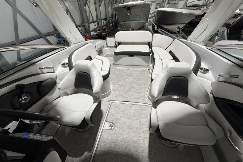 Slide: The Image of 2023 Crownline 280 SS boat interior with luxurious seating and modern design. - 9