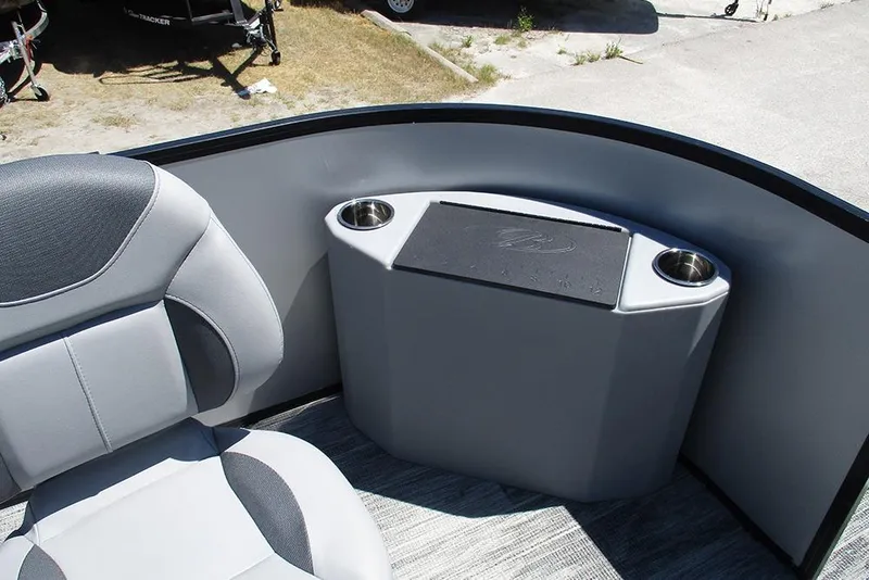 Slide: The Image of 2026 Bentley Pontoons Fish 243 4-Point interior with seating and cup holders. - 12