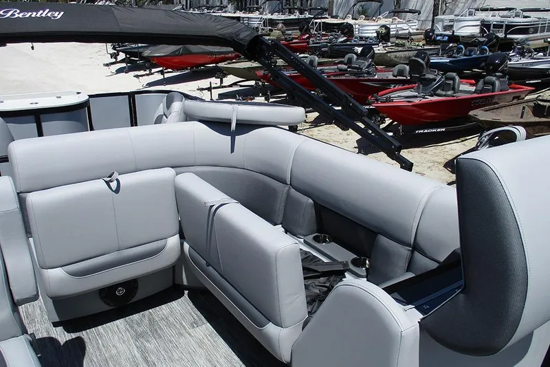 Slide: The Image of 2026 Bentley Pontoons Fish 243 4-Point interior with luxurious seating and cup holders. - 16