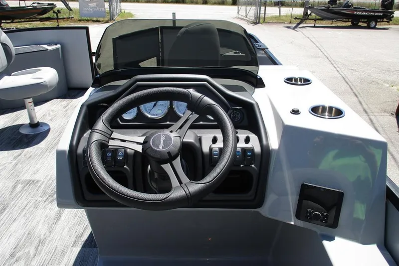 Slide: The Image of 2026 Bentley Pontoons Fish 243 4-Point dashboard with steering wheel and controls. - 26