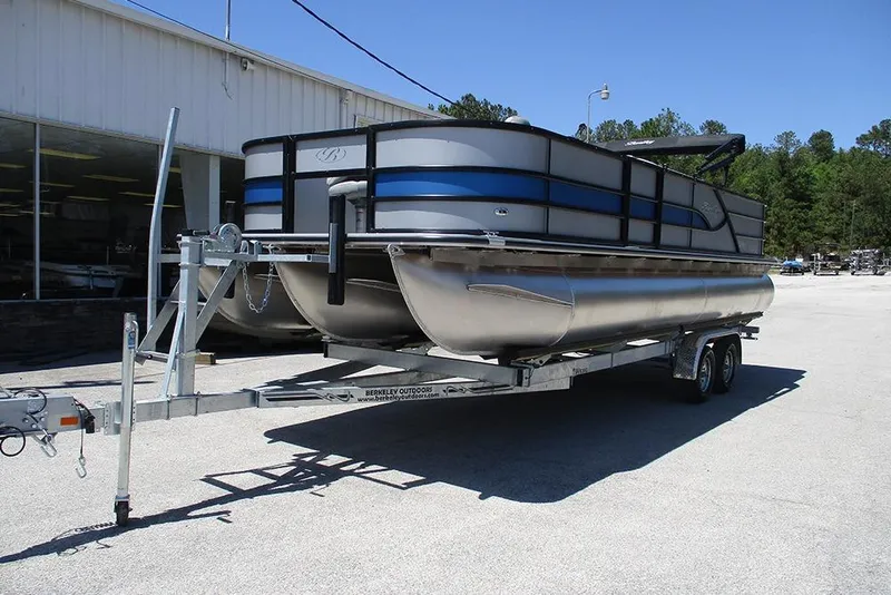 Slide: The Image of 2026 Bentley Pontoons Fish 243 4-Point on trailer outside dealership. - 3