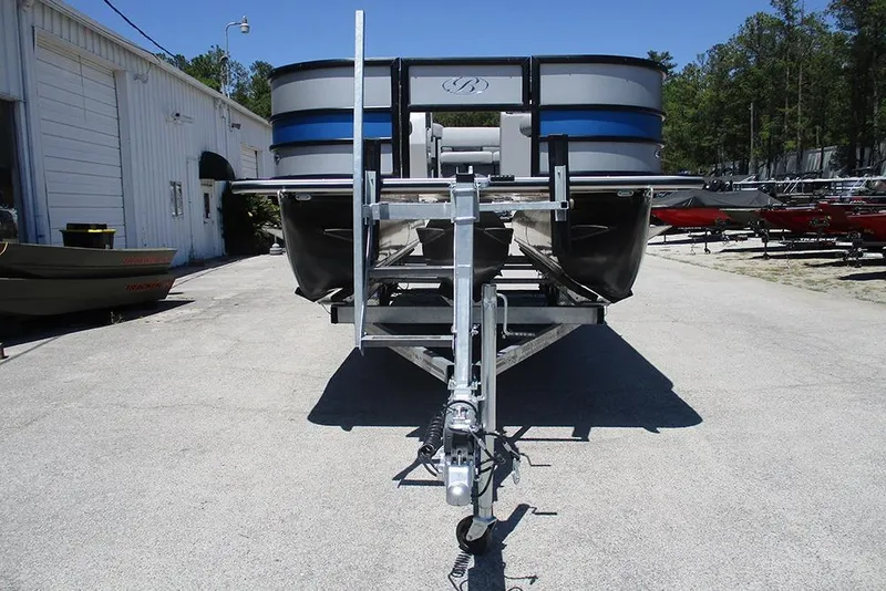 Slide: The Image of 2026 Bentley Pontoons Fish 243 4-Point on trailer, parked outdoors. - 4